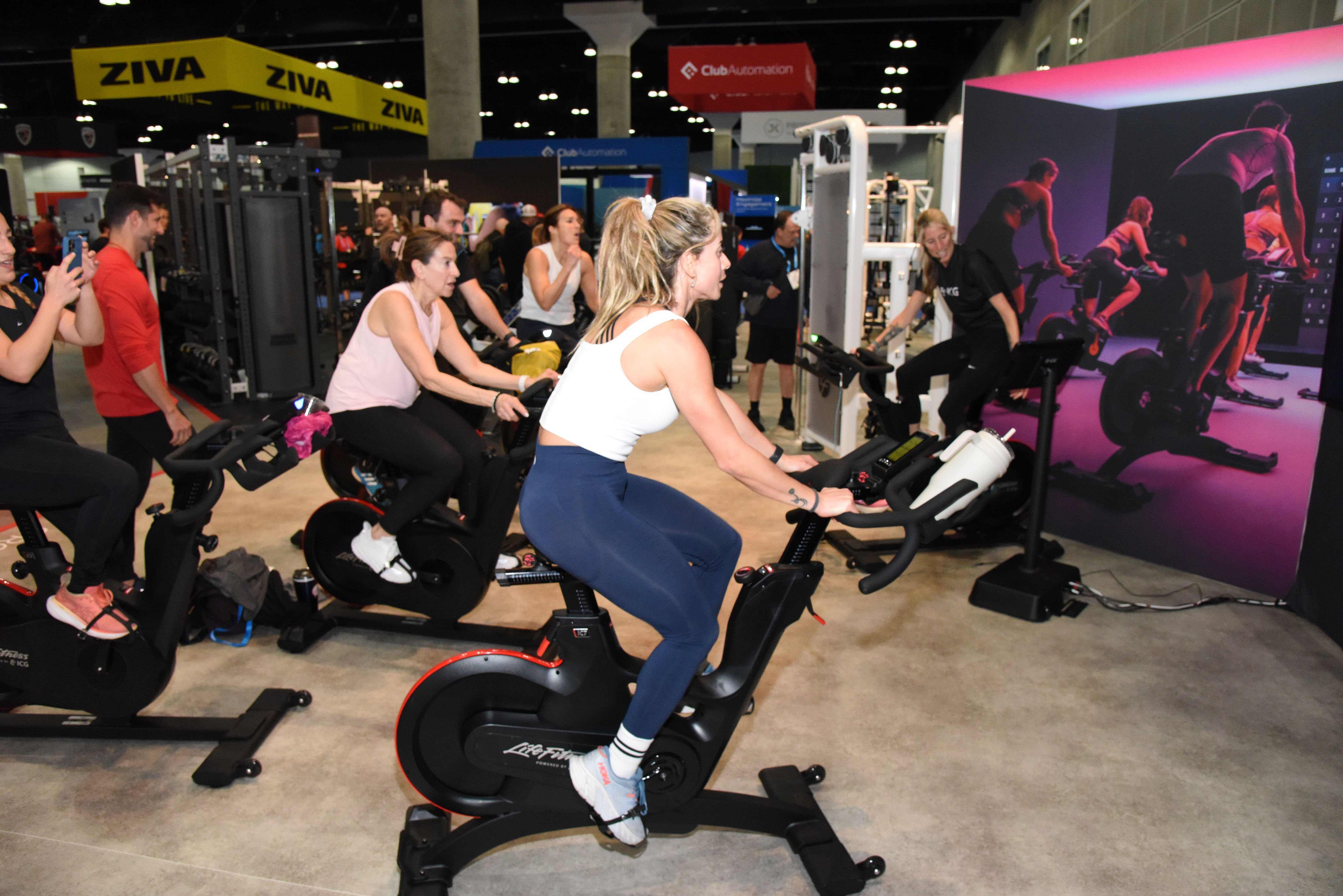 people testing exercise equipment